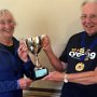 Vicky Payne receiving the President's Trophy from Mike Cross.